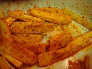 Biwogo fried cassava: add the salt & spices see to it each gets a coating