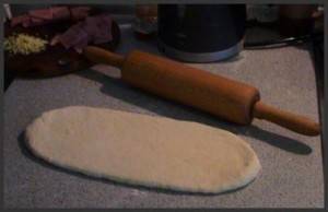 Rolling the dough for the bottom