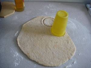 Wheat flour kabalagala: cutting the dough into round shapes