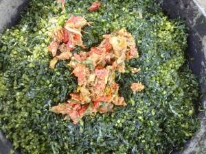 Wure bourakhe sauce: adding the above mixture to the sweeting potato leaves