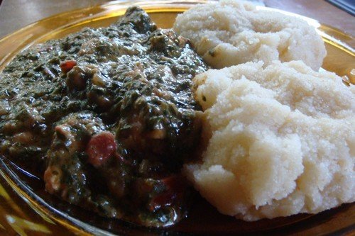 Vita's Spinach and Chicken in Groundnut Sauce served with posho/ugali