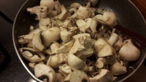 Frying mushrooms and onions